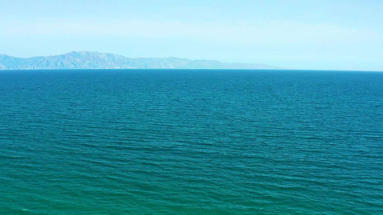 At one second, the ocean surface fills most of the frame while the distant land sits centered on the horizon in the El Sargento La Ventana coastal view, with no visible people.