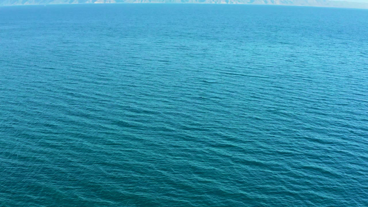 Elevated ocean view in El Sargento La Ventana, Mexico, showing darker blue surface patterns in the foreground and no visible people.