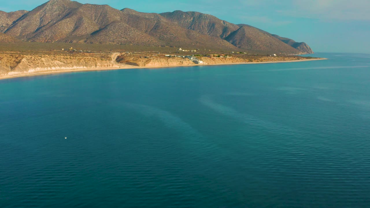 Coastal mountain landscape above calm blue water