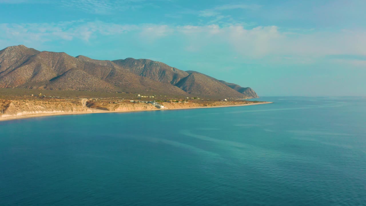 Aerial coastal landscape with mountains and open sea