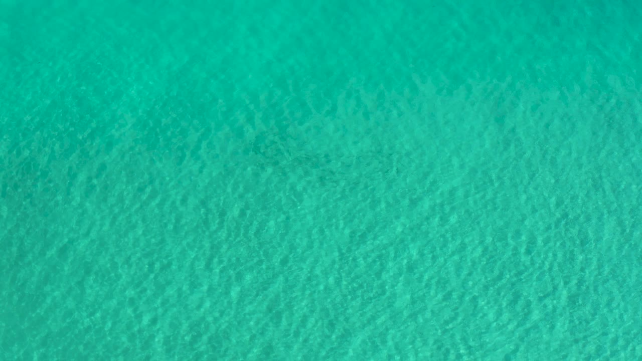 Blue-green Los Cabos water fills the second frame, with soft rippling texture spread evenly across the image and no visible people.