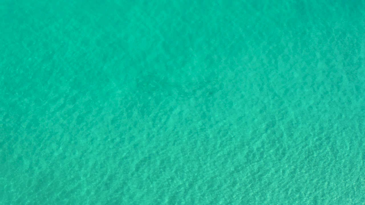 Teal ocean surface filling the frame