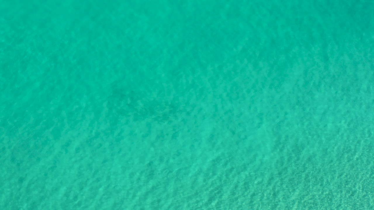 Turquoise ocean surface with fine ripples