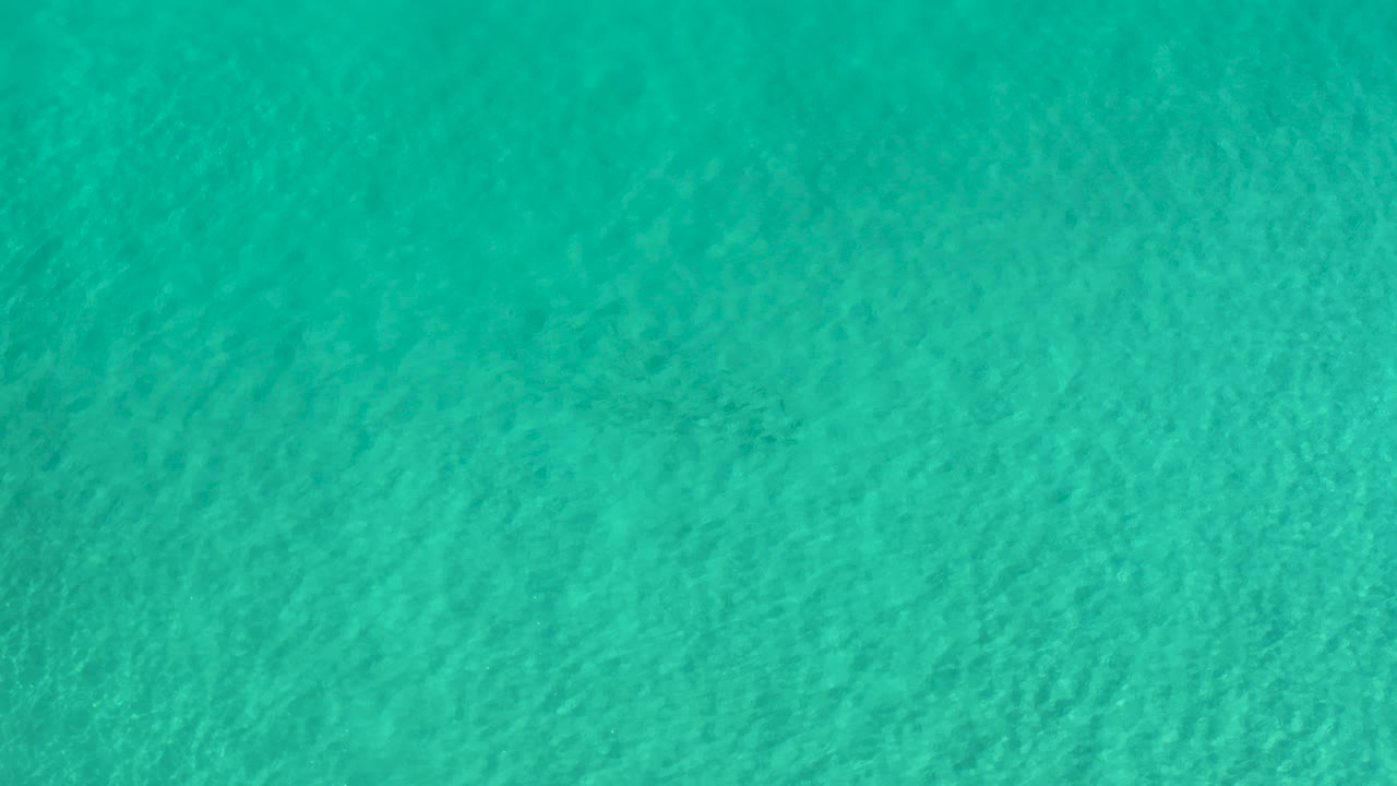 Overhead blue green rippling pool water