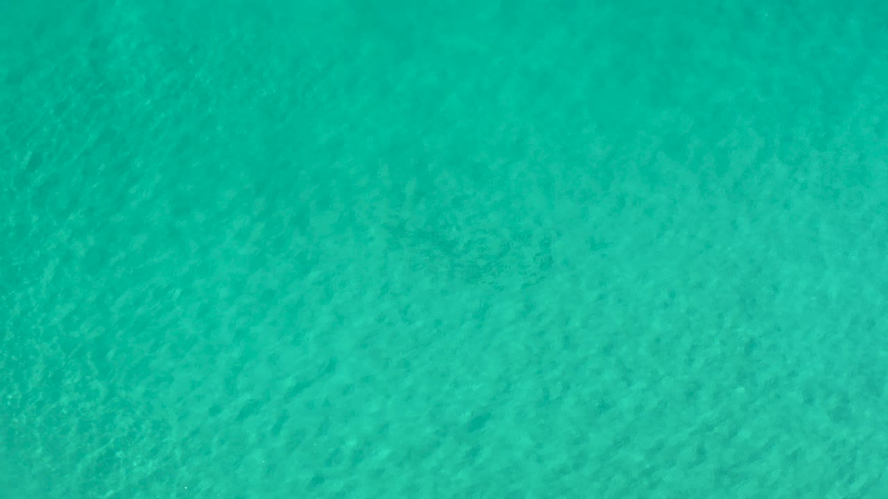 Turquoise ocean surface with fine ripples