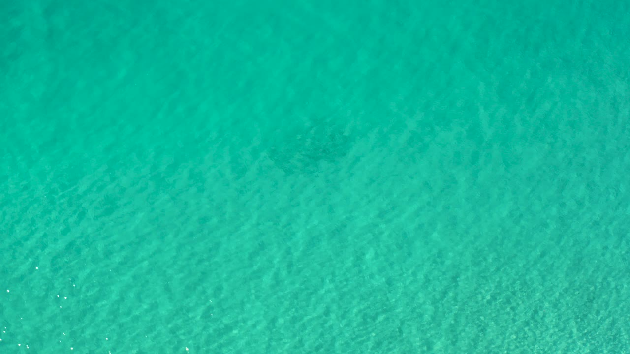 Aquamarine shallow water with fine ripples