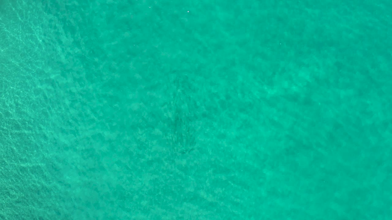 Green blue water with soft ripple bands