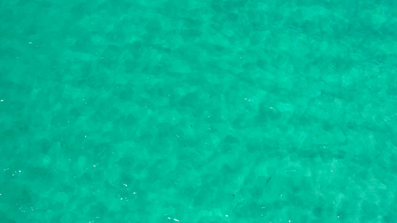 Turquoise green ocean water with soft ripples