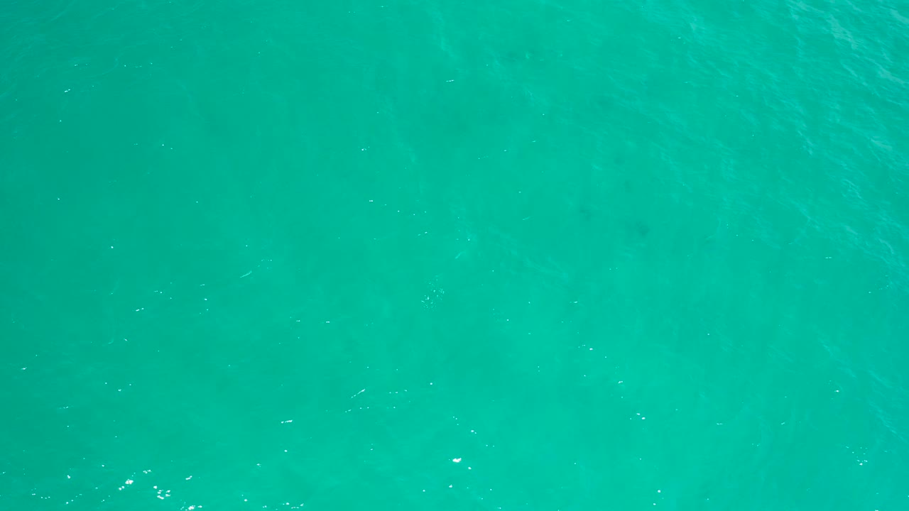 Blue-green ocean surface in San Jose Del Cabo fills the frame, with soft ripple lines and no visible people or structures.