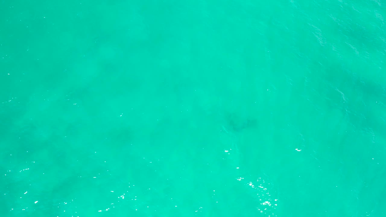 Turquoise ocean water seen from above