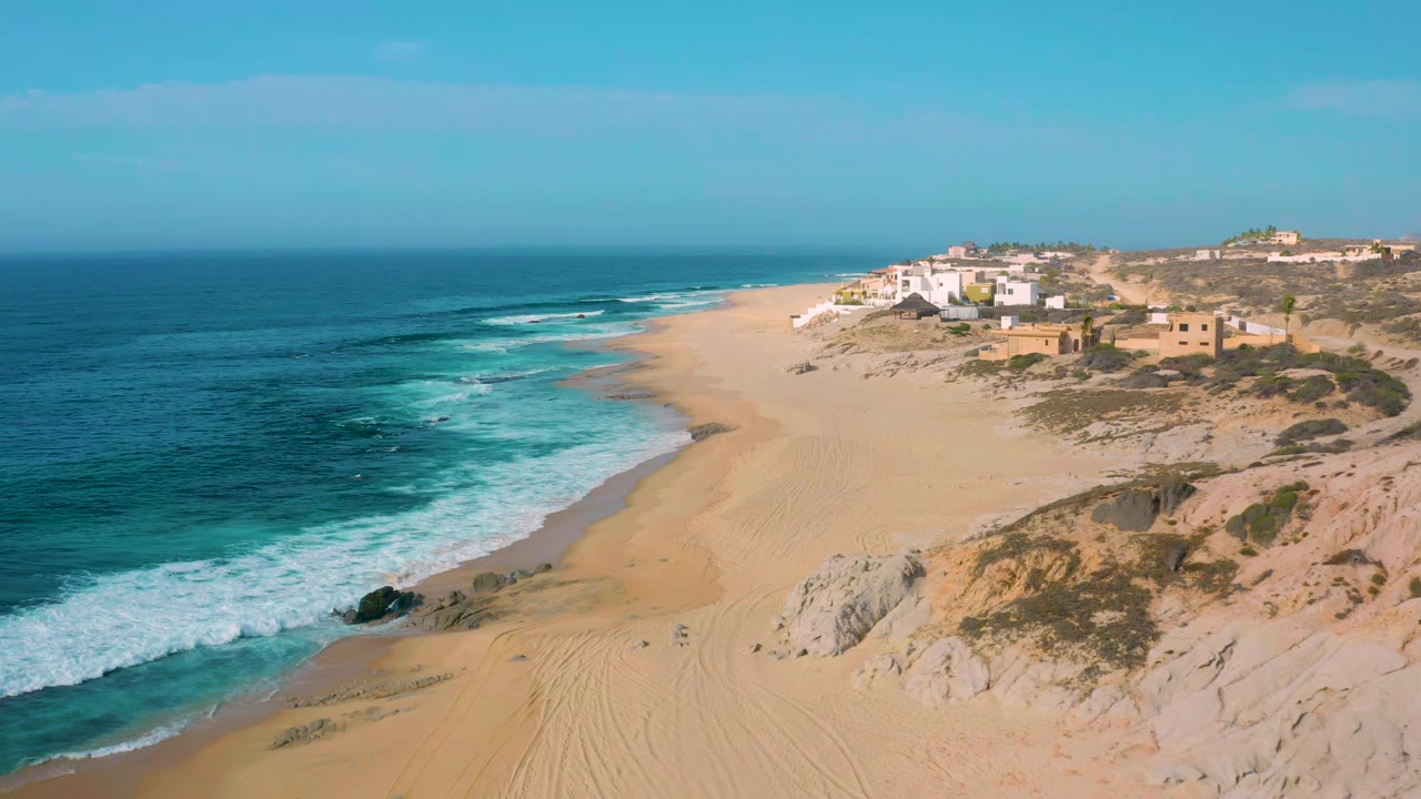 The second frame shows Shipwrecks Beach from above, with turquoise surf advancing along the left edge of the sand and no visible people on the shoreline.
