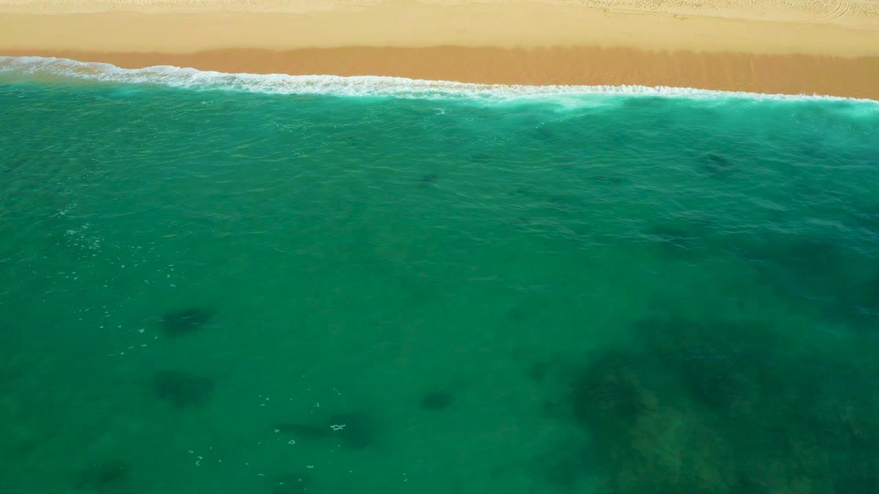 Beach and shallow water seen from directly overhead