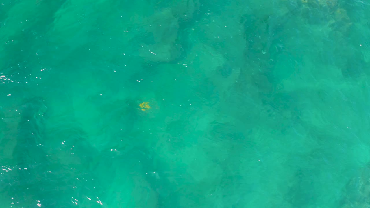 Green-blue ocean water with faint ripples