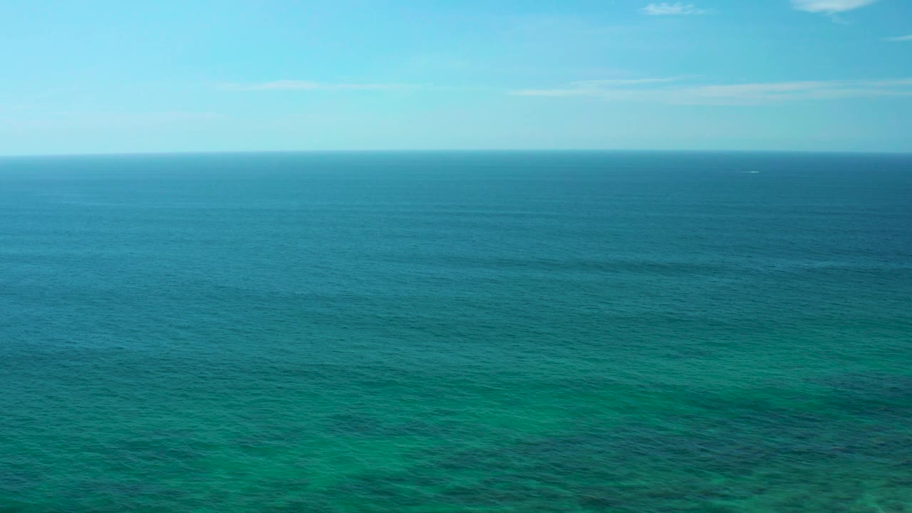 Blue-green ocean fills the frame at Shipwrecks Beach, Baja California Sur, with the horizon high in the image and no visible people.