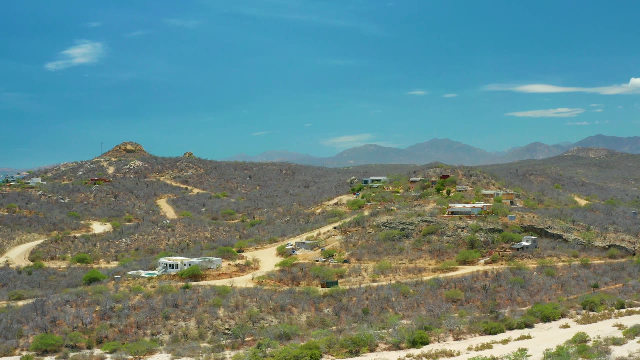 Aerial view of hillside homes and winding dirt roads