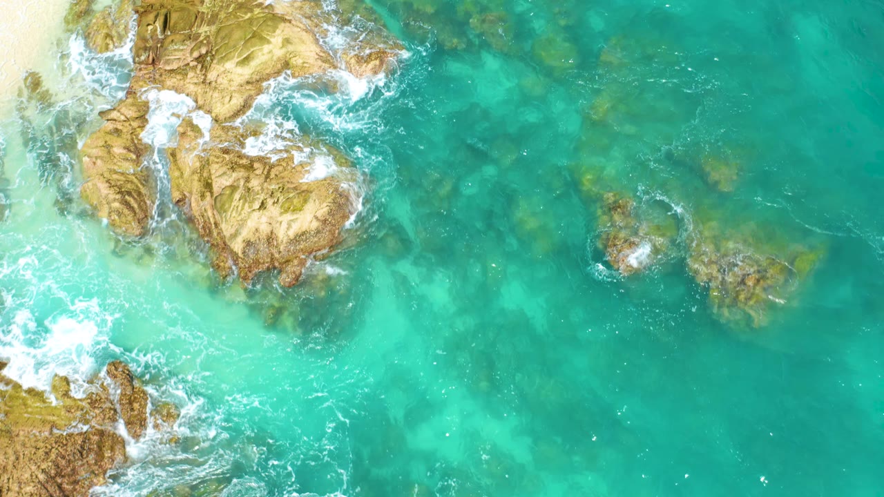 Aerial rocks with surf and submerged formations