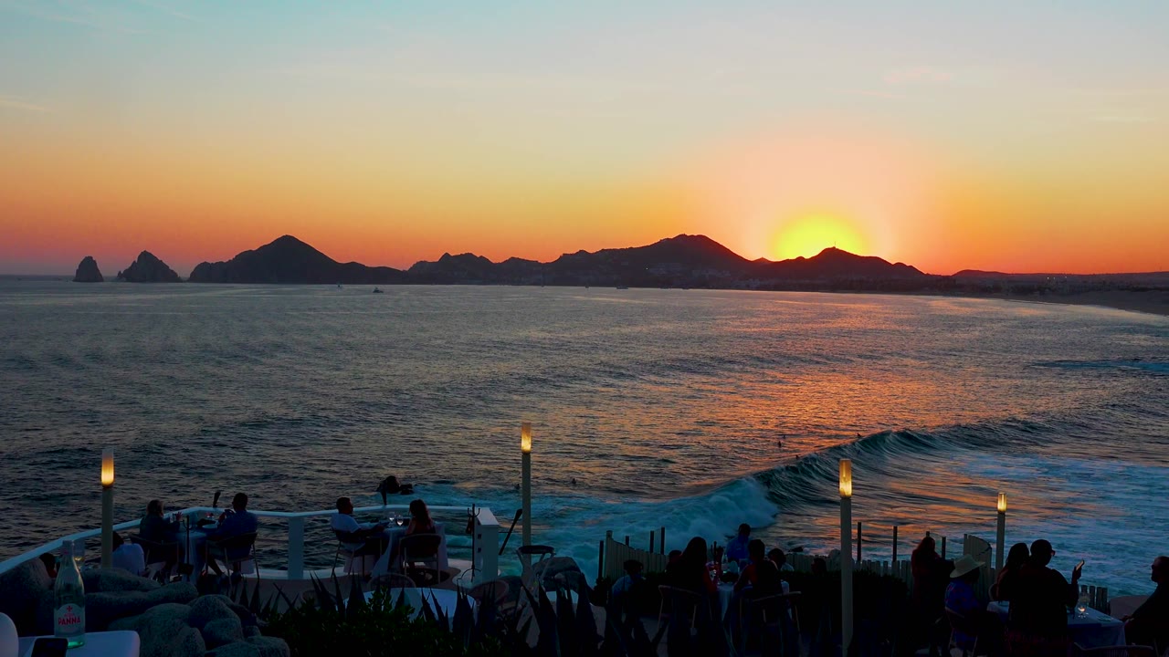 Sunset ocean view with foreground terrace and distant rocks