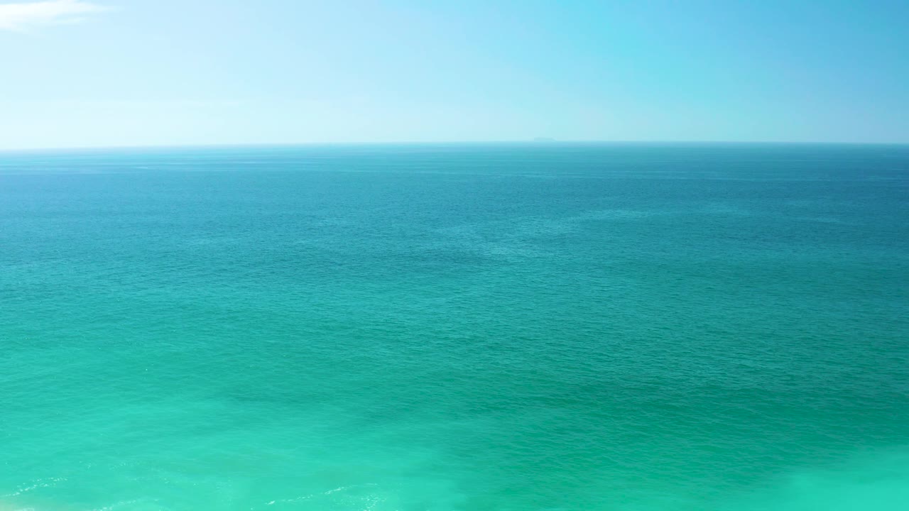 Fourth frame shows a wide Dreams Los Cabos ocean horizon, with bright turquoise water in the lower frame, deeper blue water beyond, and no visible people.