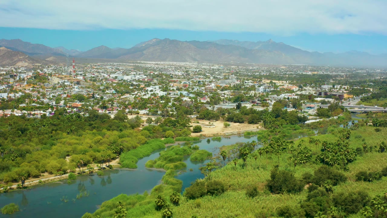 Town and river valley seen from an elevated wide angle.