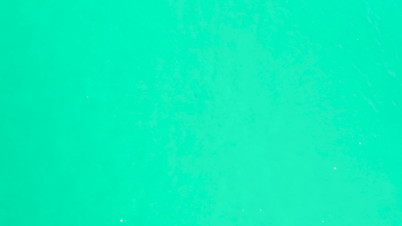 Clear blue-green water fills the second frame, with a faint horizontal tonal shift and no visible people at Marquis Los Cabos.