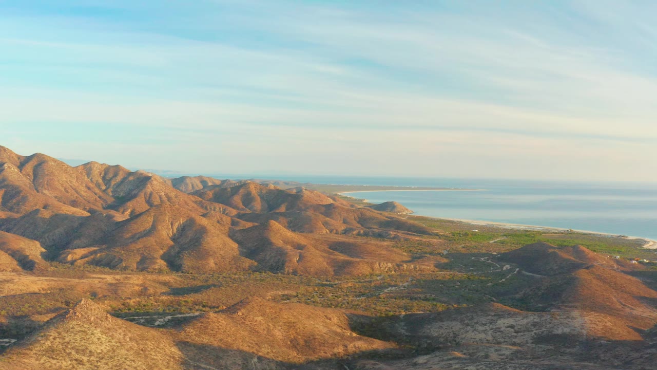 Mountain valley and ocean coast seen from above