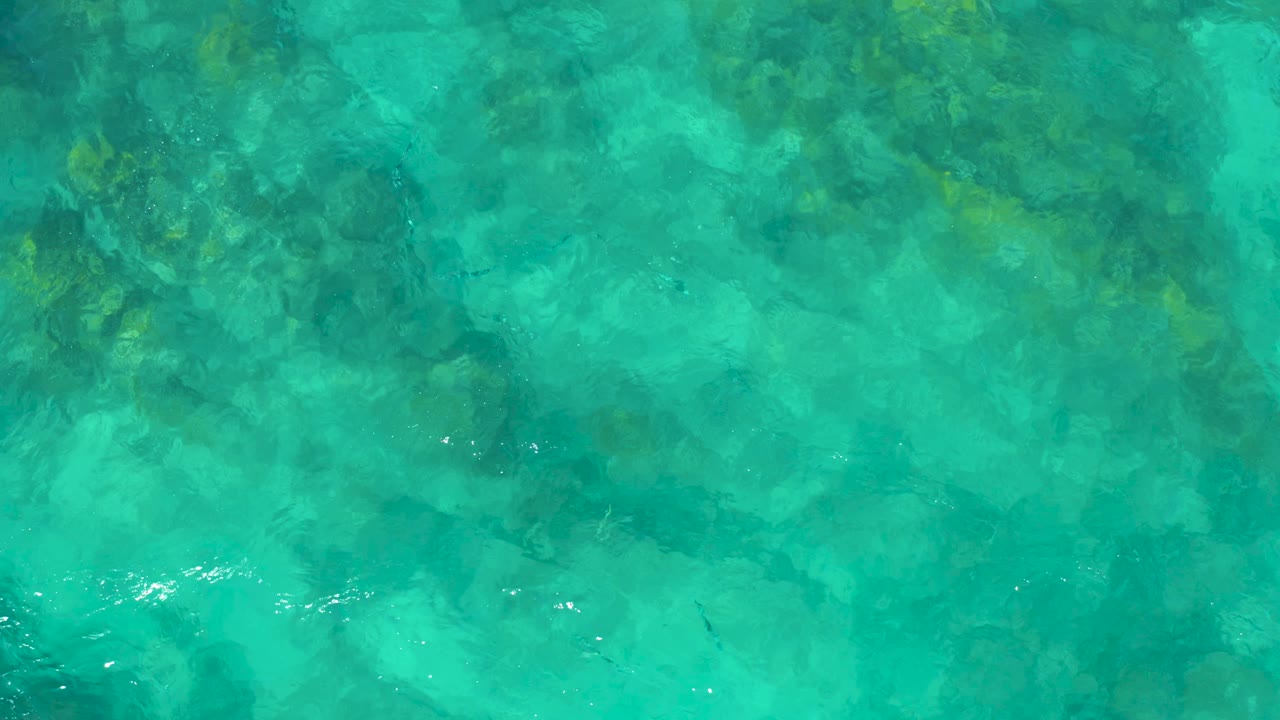 Aerial water view with coral and rock texture