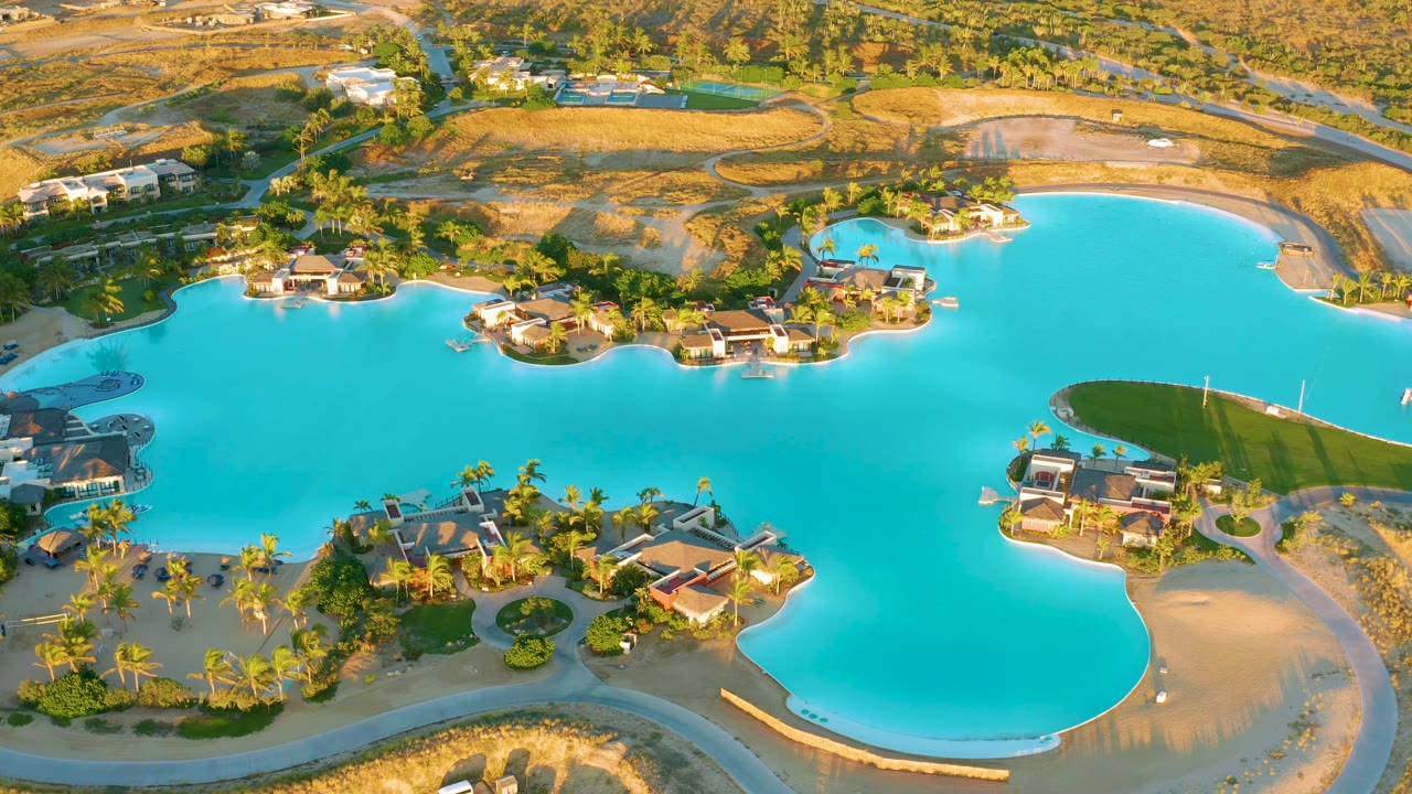 Aerial lake view with a white vehicle near the lower road