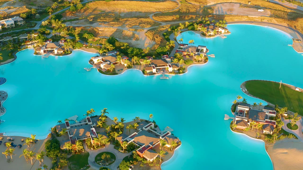 Overhead view of blue lagoon and villa islands