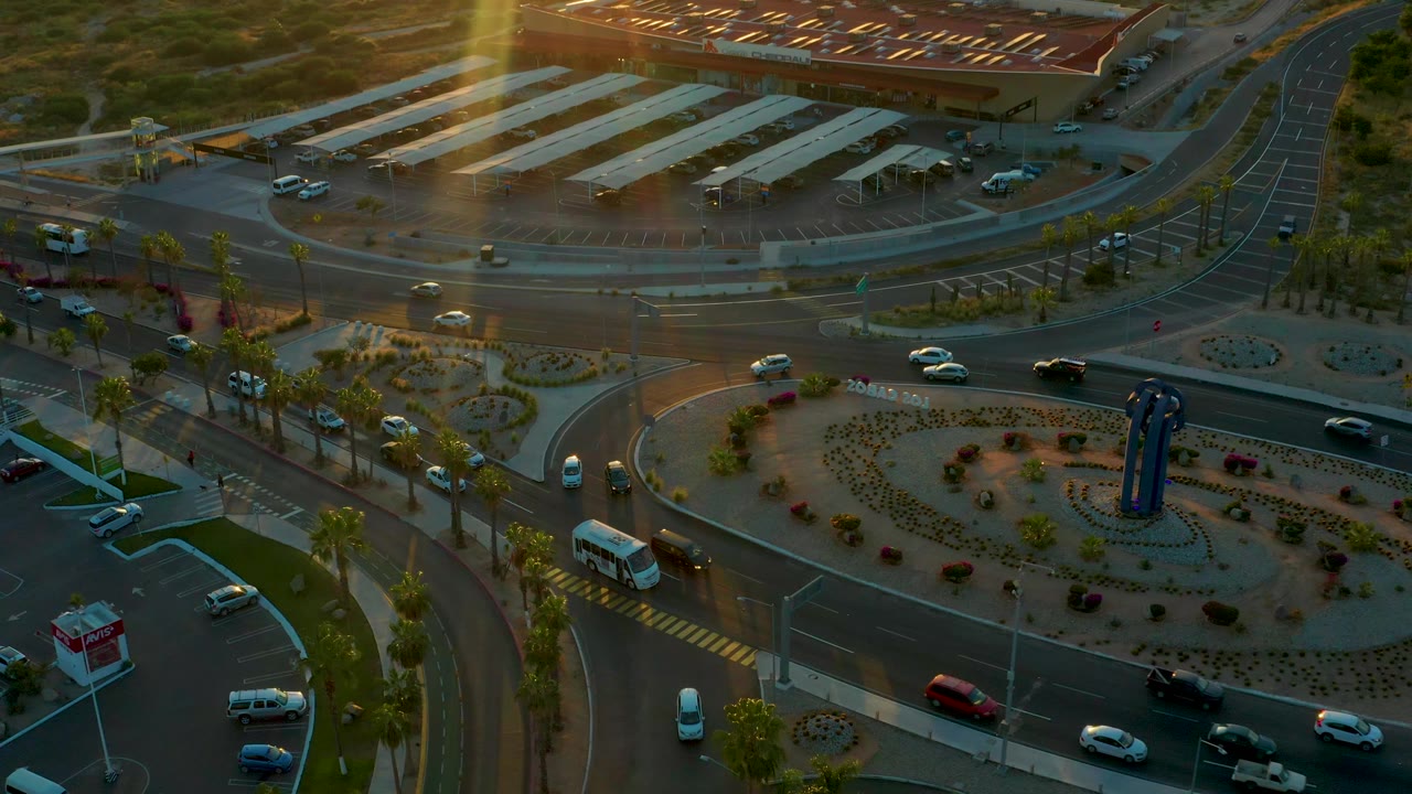Closer aerial view of traffic lanes around a roundabout.