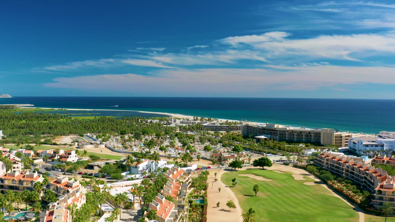 Elevated resort panorama with golf course and ocean coastline