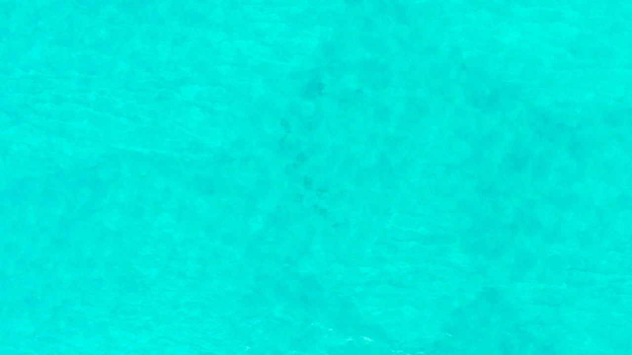Turquoise shallow water with faint underwater texture