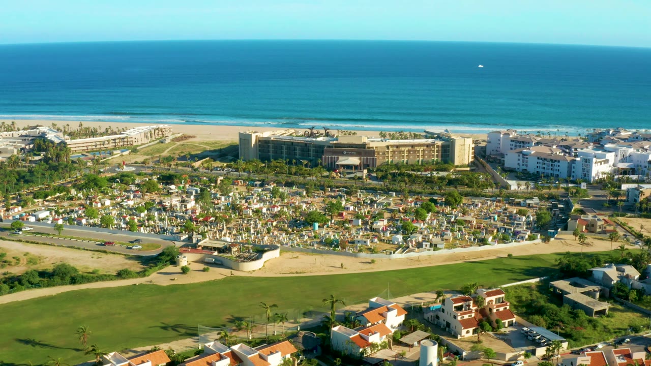 Beachfront development and golf course seen from elevated coastal angle