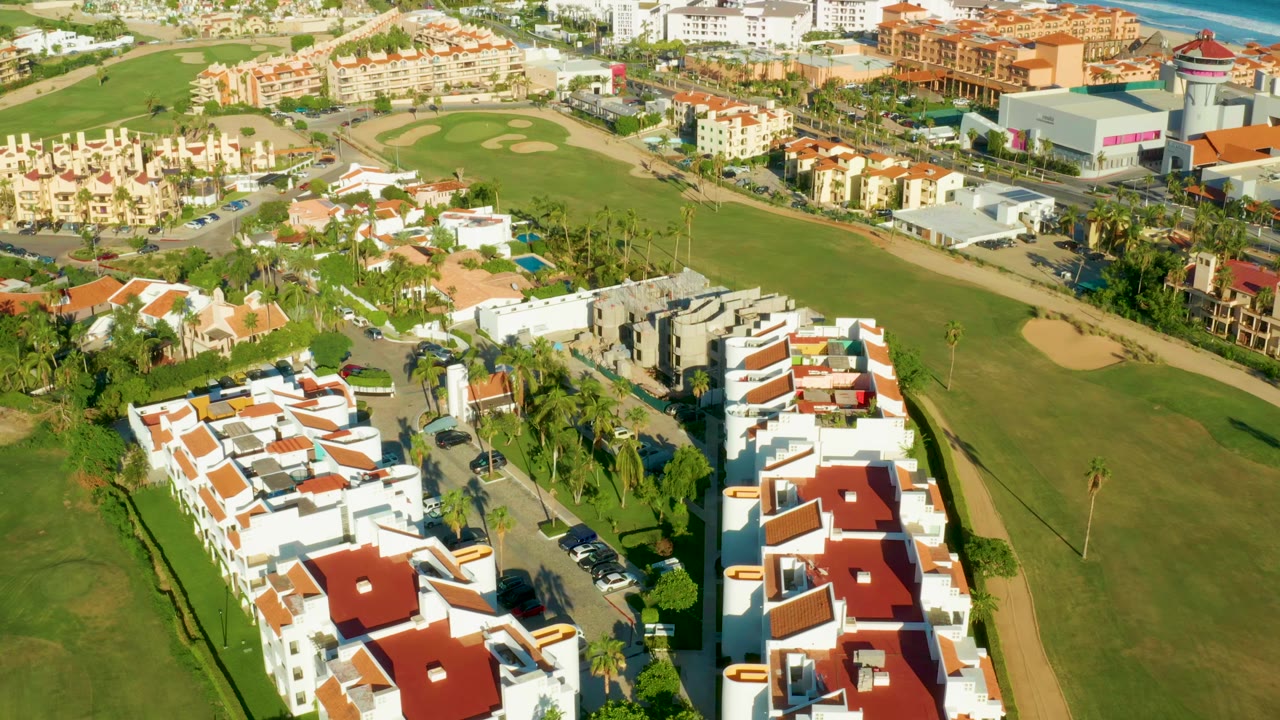 Aerial view of fairway bordered by homes and roads