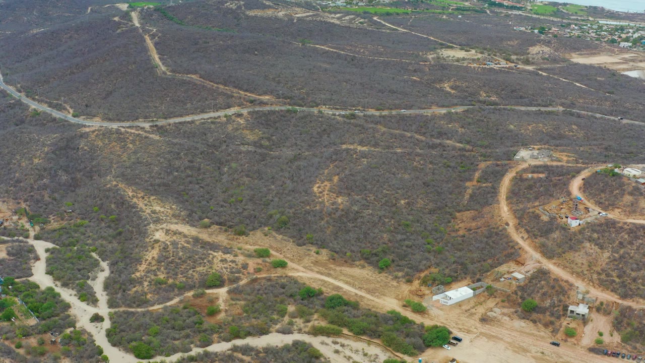 Aerial hillside landscape with intersecting dirt roads