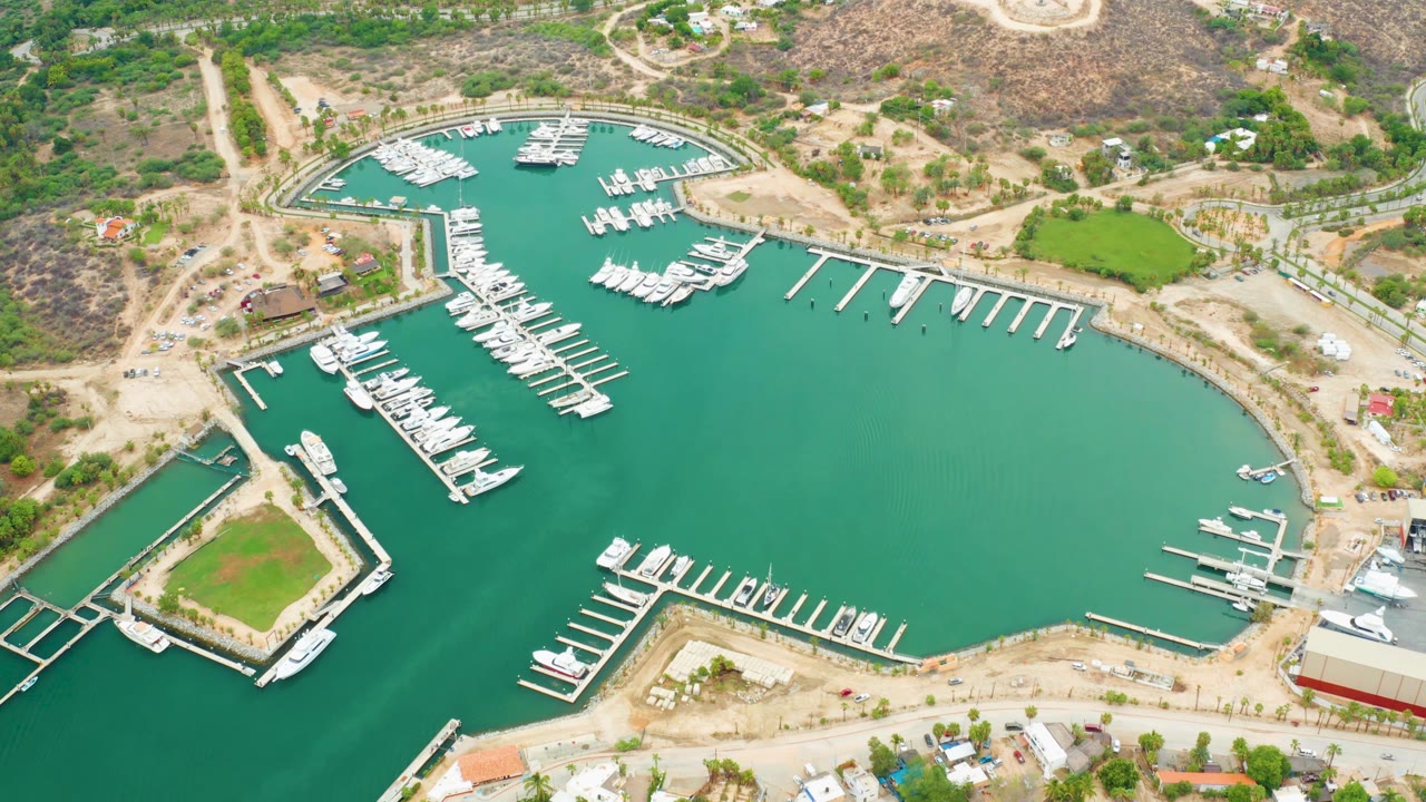 Aerial harbor view with dock fingers and dry surrounding land