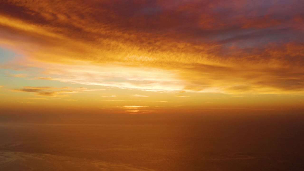 Golden sky and ocean reflection at sunset