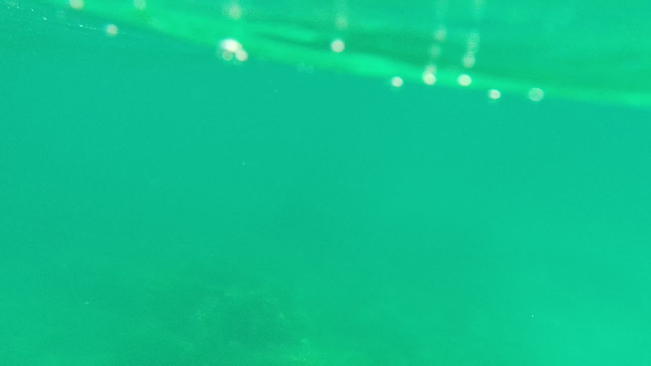 Clear underwater water with soft seabed detail