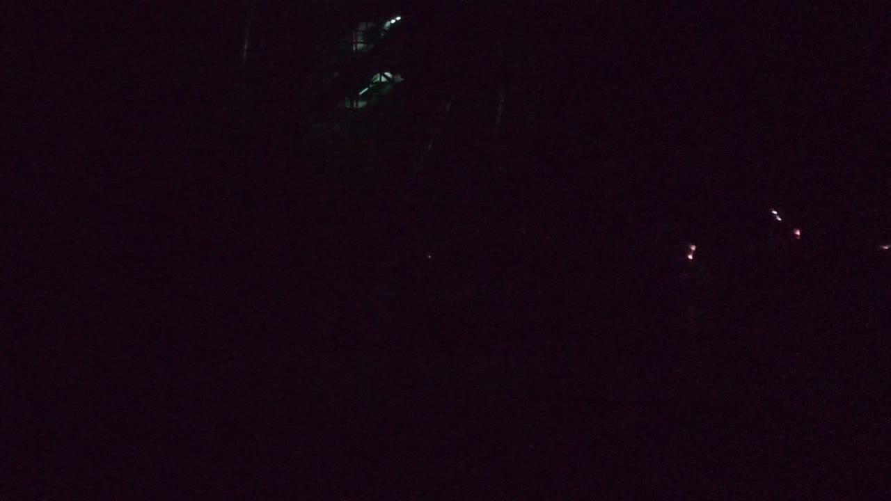 At 0:00 in San Jose Del Cabo, faint green light clusters and small red points appear against a nearly black background with no visible people.