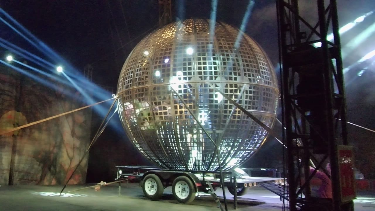 Metal sphere trailer with brighter internal light and angled stage beams