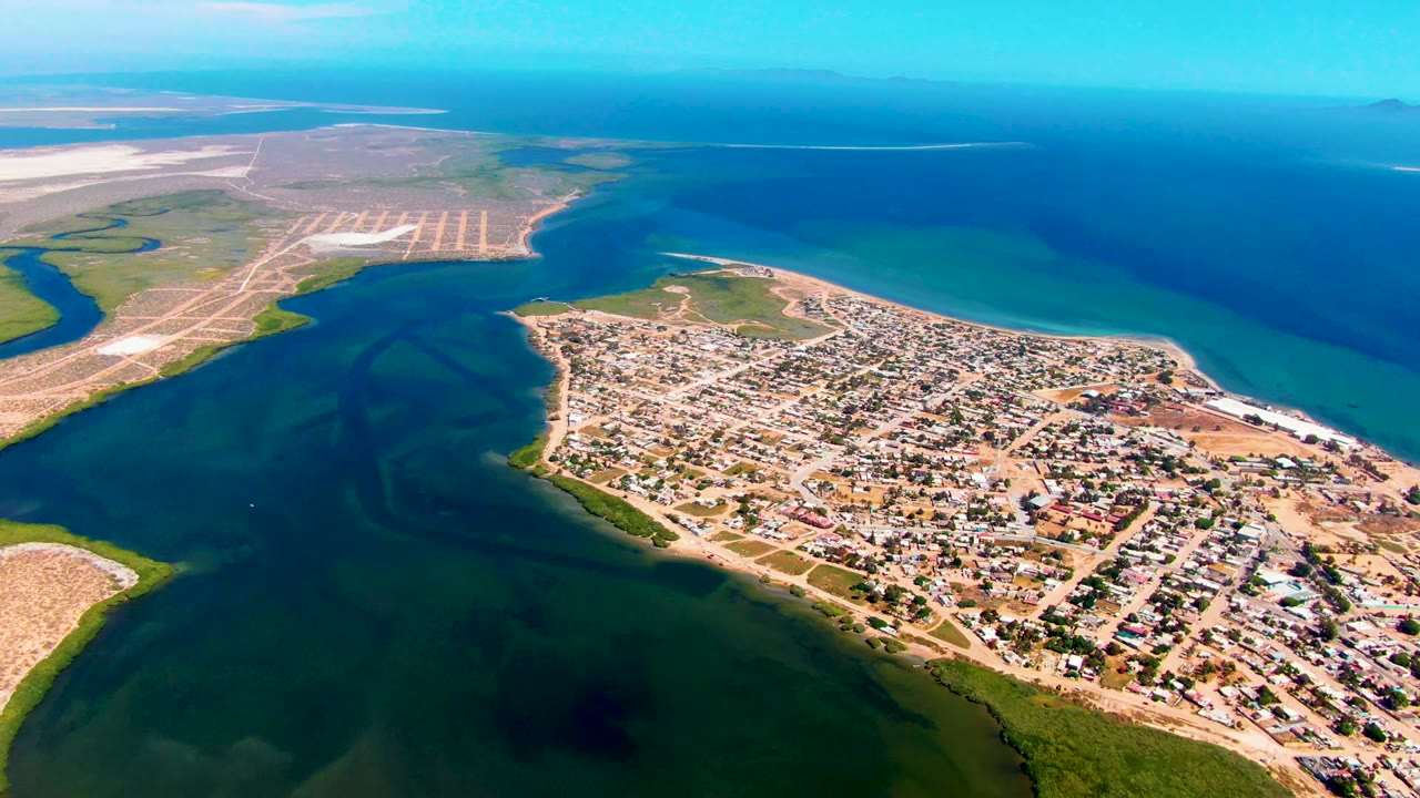Coastal settlement and green inlet water from above