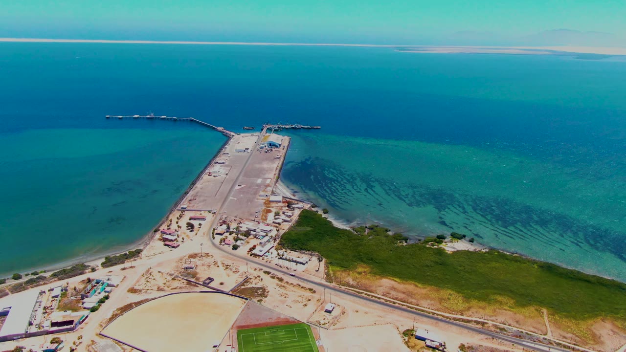 Coastal causeway and adjacent shoreline seen from above.