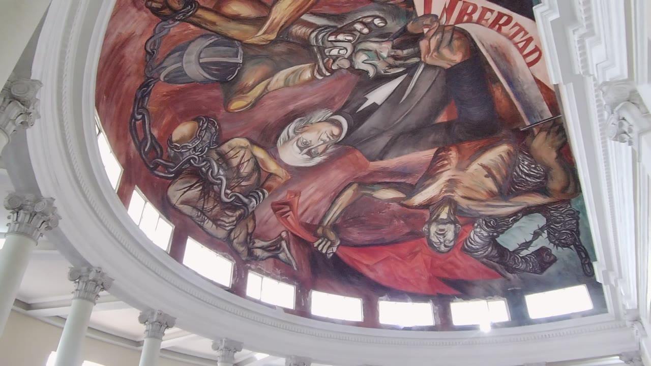 Dome ceiling mural with red fabric, chains, and bright window openings.