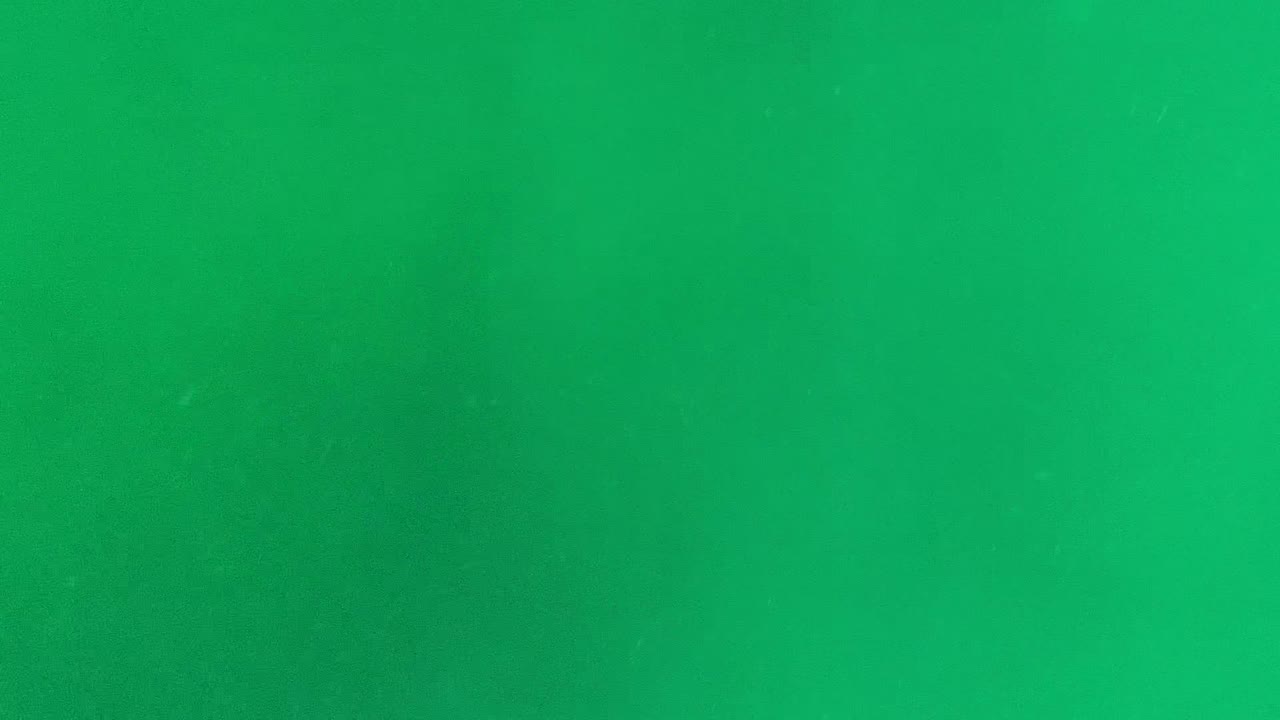 Green-tinted underwater view in Cabo Pulmo with small particles suspended in open water and no visible people.