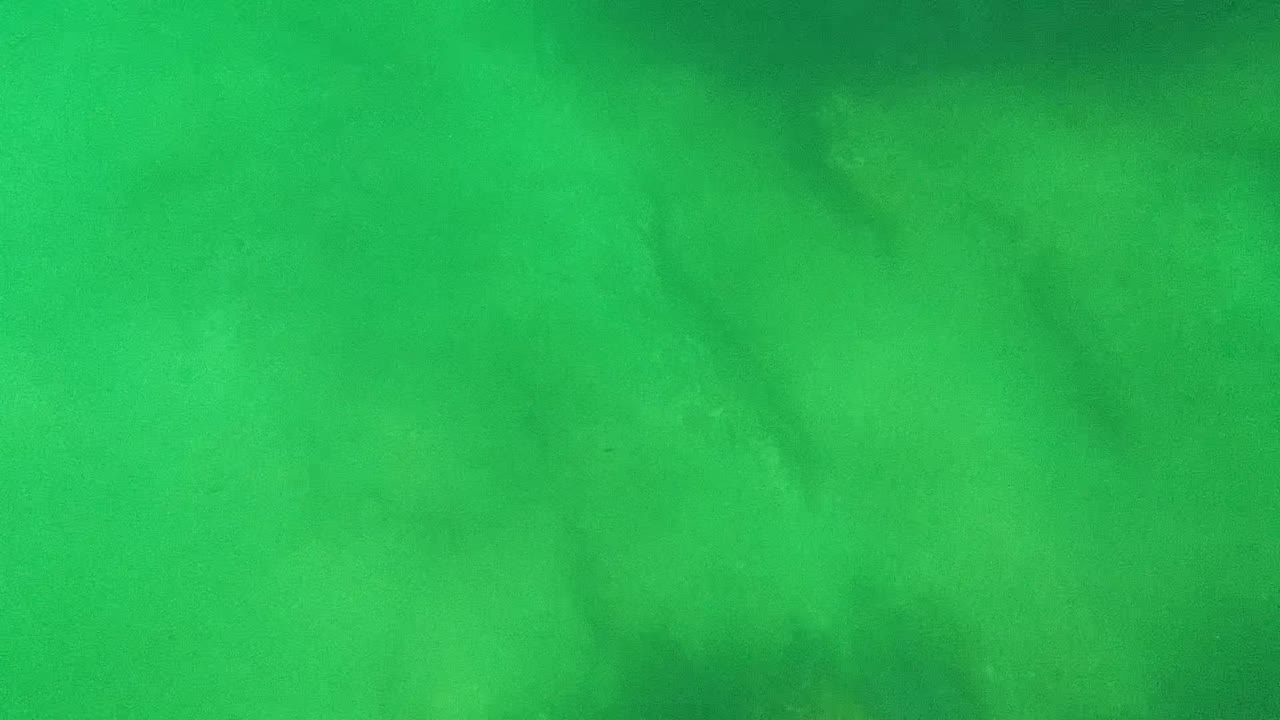 Green water and sandy bottom with darker shadow areas.