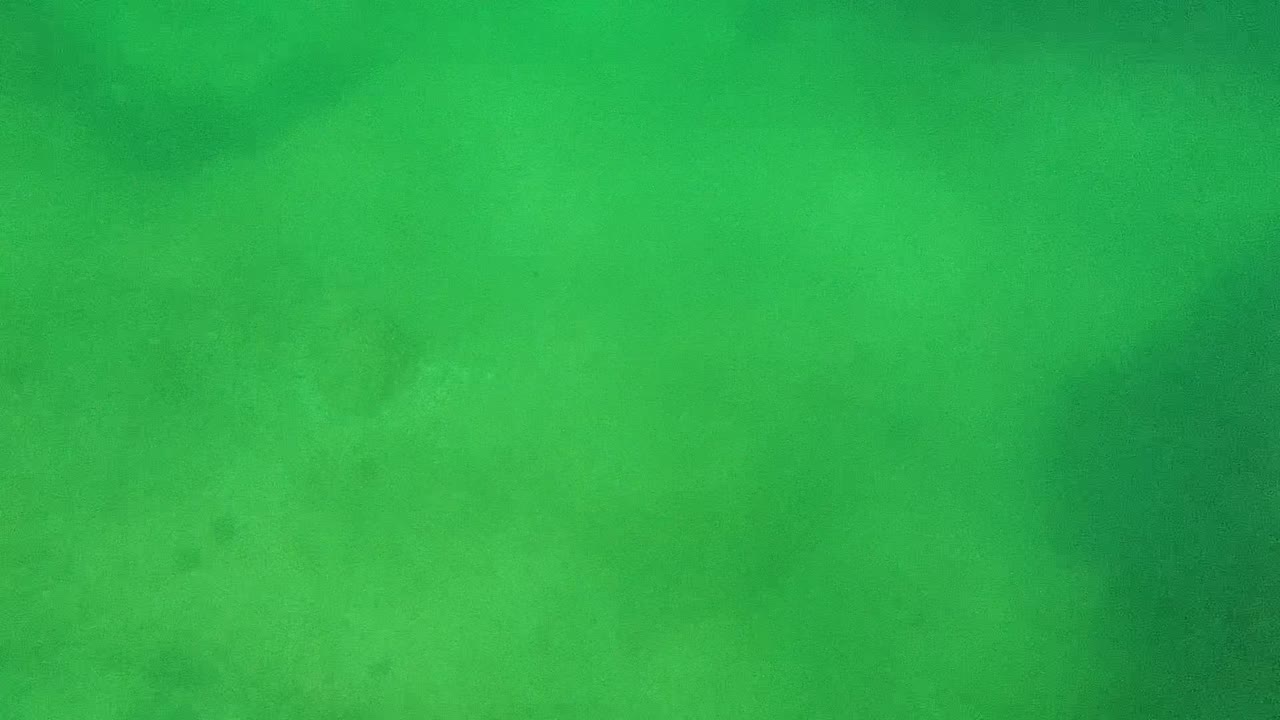 Underwater seabed with green cast and shadowy coral patches