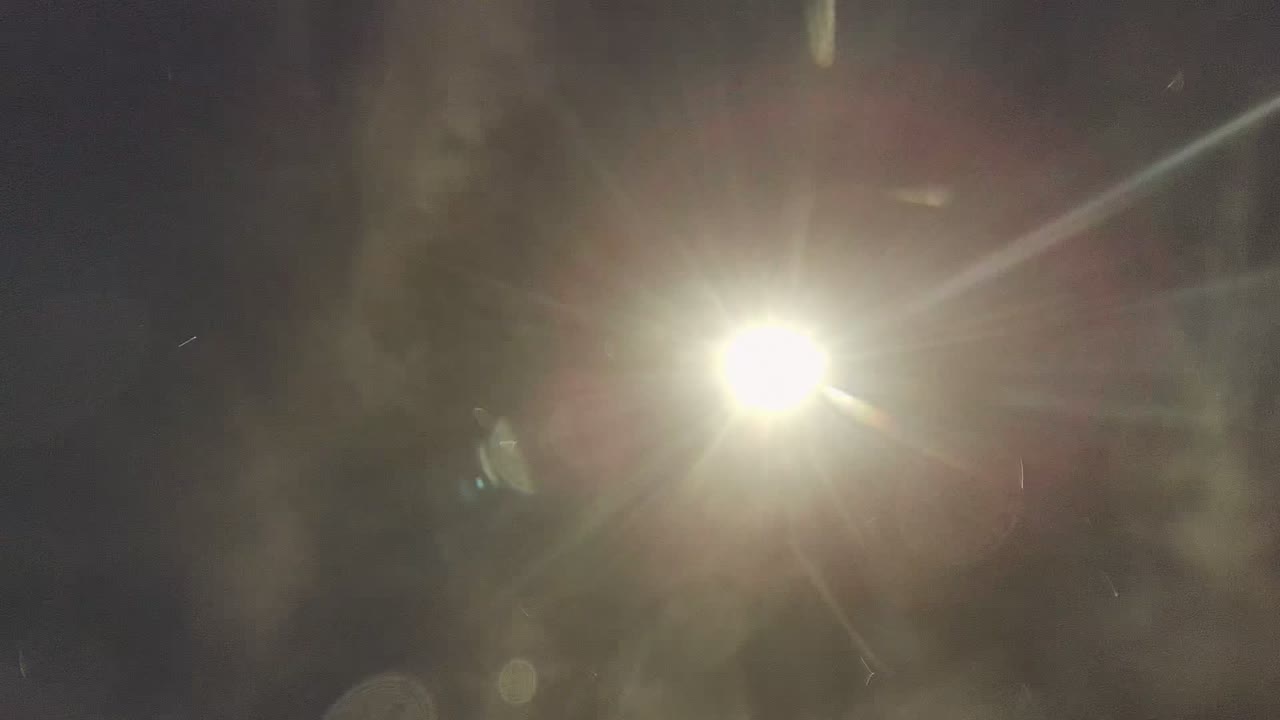 Bright sun glare seen through the underwater surface