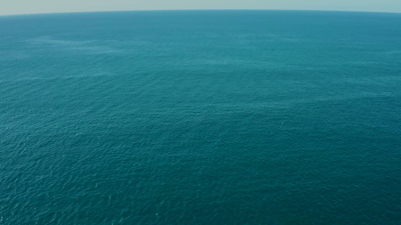 The ocean near La Fortuna, Baja California Sur appears mostly blue with only subtle surface highlights, a level horizon, and no visible people.