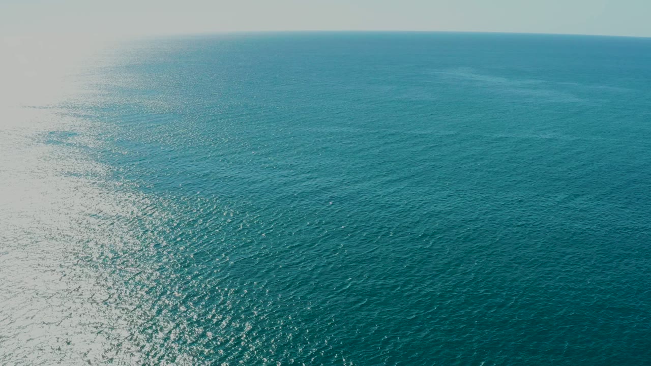 Blue-green ocean surface near La Fortuna, Baja California Sur, with a softened horizon line, small ripples, and no visible people.