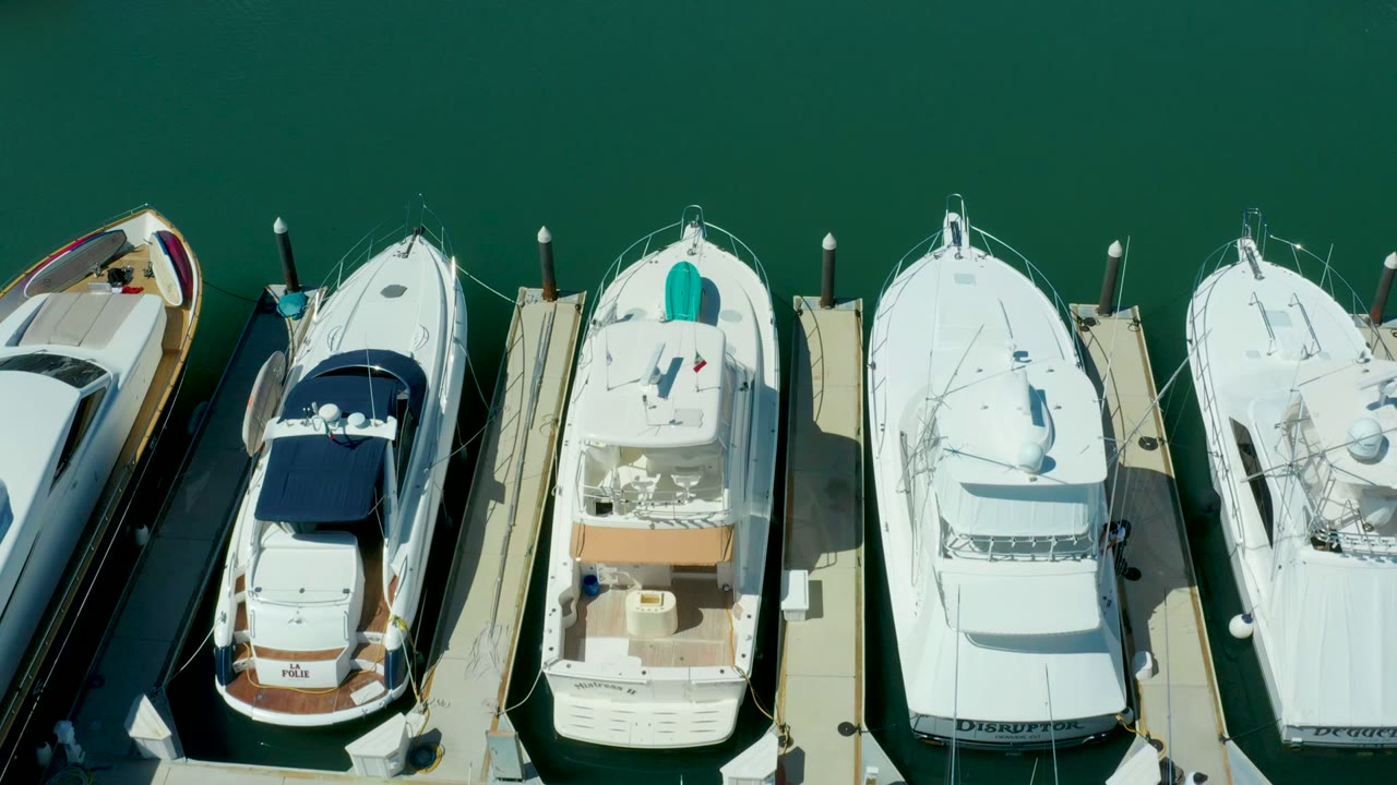 White yachts and slips viewed from directly above.