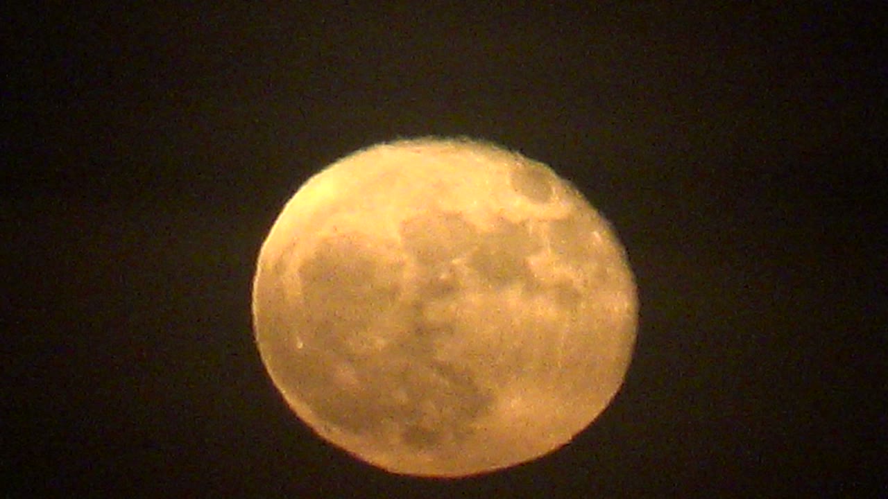 Full moon with thin haze over its surface